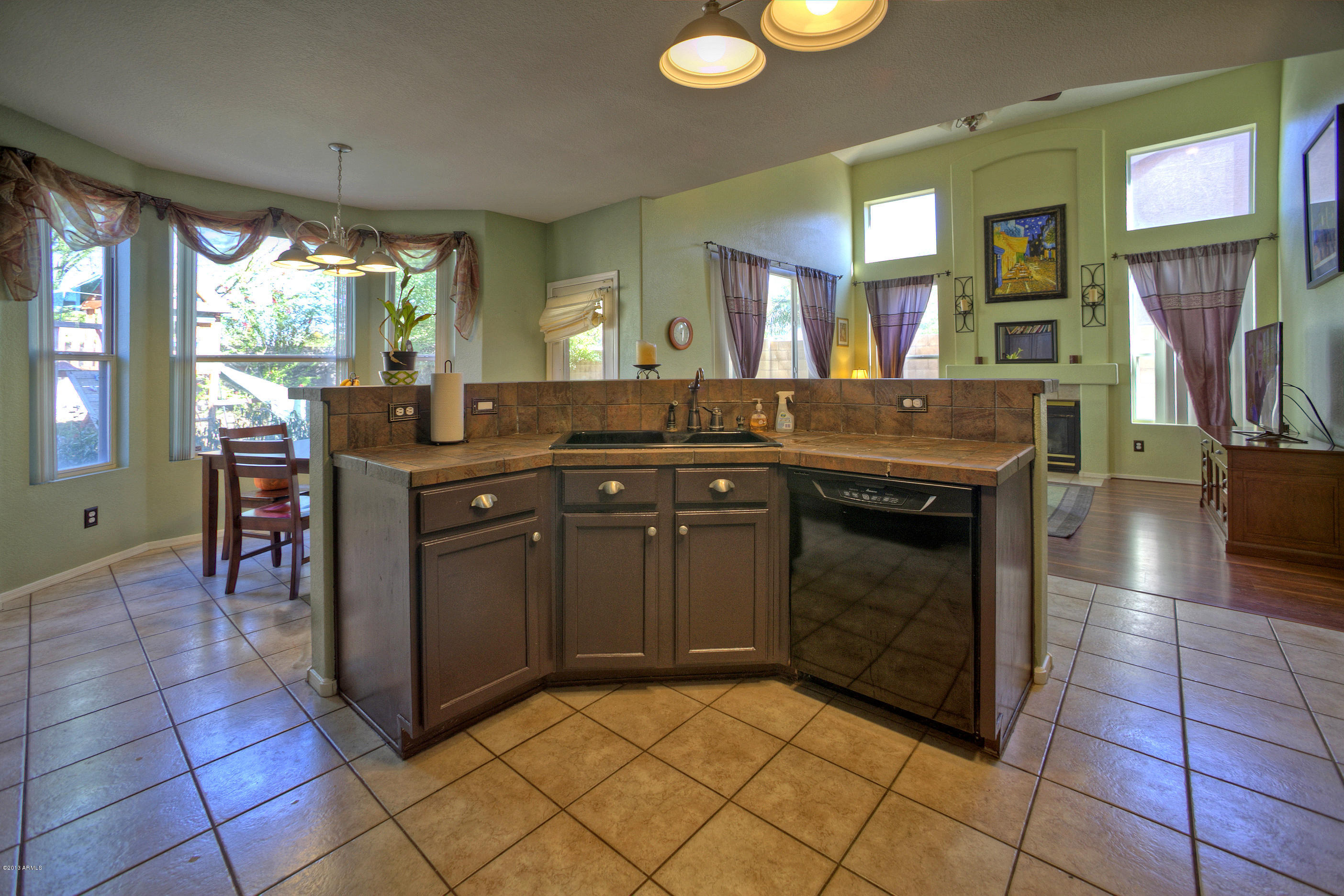 4510 East Rowel Road Phoenix, AZ 85050 - Photo 10 of 29 a kitchen with stainless steel appliances granite countertop a stove a sink and a microwave