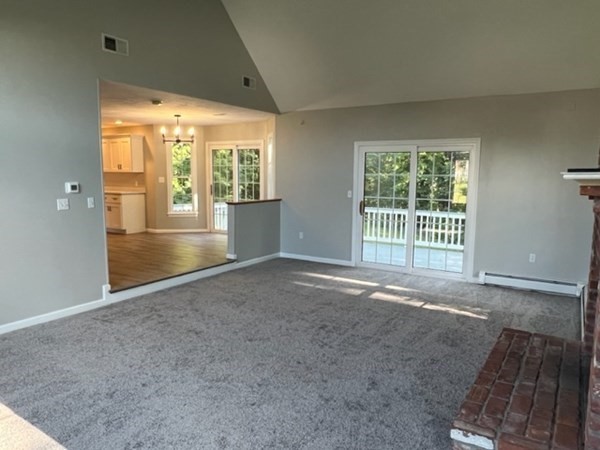 5 Winesap Way Ashland, MA 01721 - Photo 11 of 22 an empty room with floor to ceiling windows and walls
