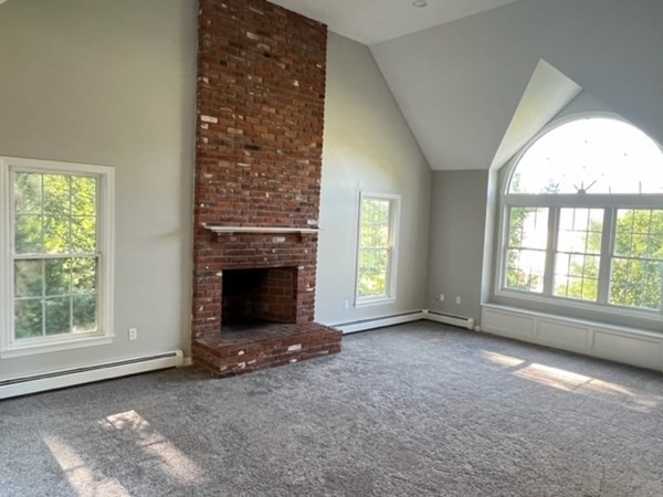 5 Winesap Way Ashland, MA 01721 - Photo 12 of 22 an empty room with windows and fireplace