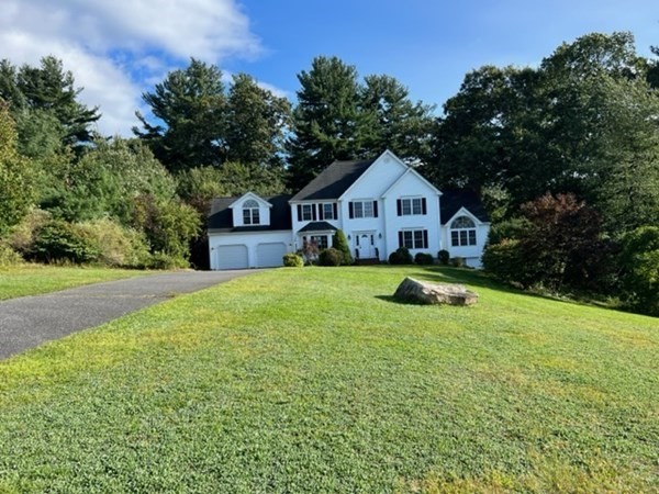 5 Winesap Way Ashland, MA 01721 - Photo 2 of 22 a view of house with yard and trees in the background