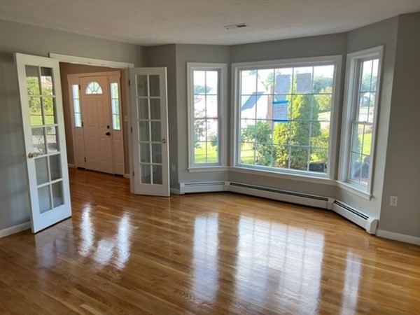 5 Winesap Way Ashland, MA 01721 - Photo 7 of 22 a view of empty room with wooden floor and fan