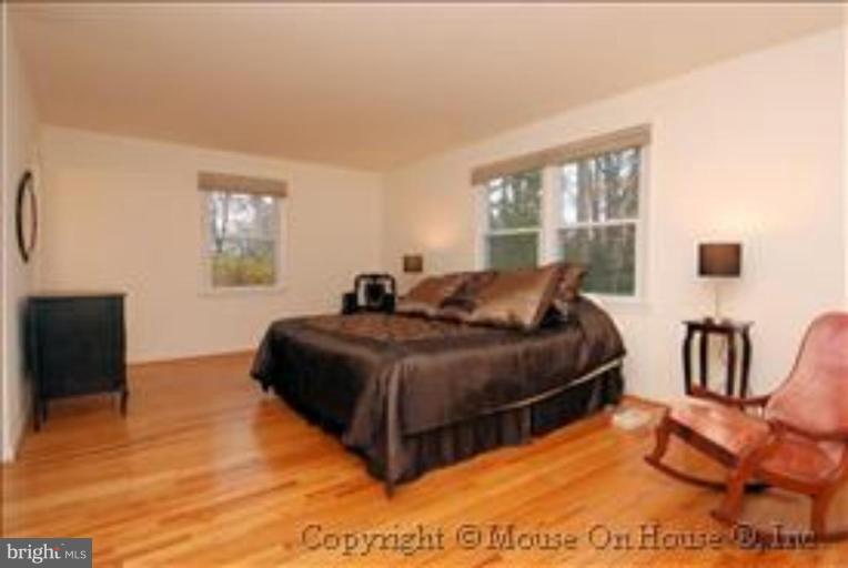 9211 Friars Road Bethesda, MD 20817 - Photo 14 of 30 Master Bedroom overlooks the trees w/ 3 exposures