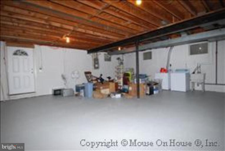 9211 Friars Road Bethesda, MD 20817 - Photo 23 of 30 Unfinished basement w/ high ceilings & sep entrnc