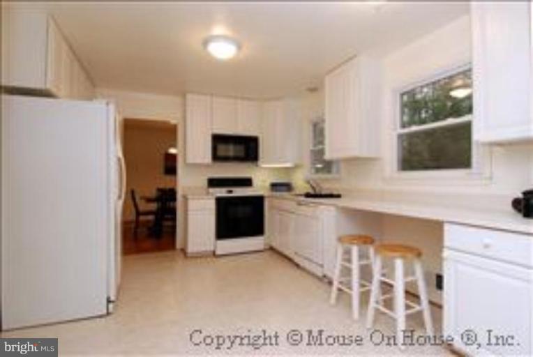 9211 Friars Road Bethesda, MD 20817 - Photo 6 of 30 All white kitchen is perfect decorating backdrop