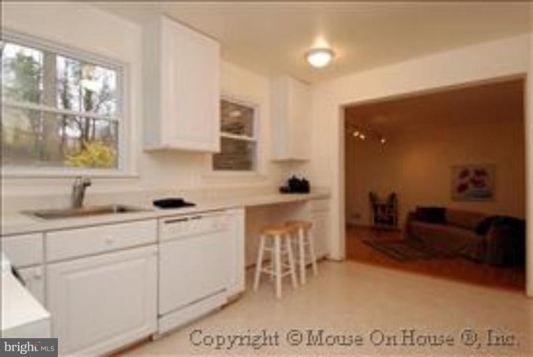 9211 Friars Road Bethesda, MD 20817 - Photo 7 of 30 Kitchen Opens to Large Family Room