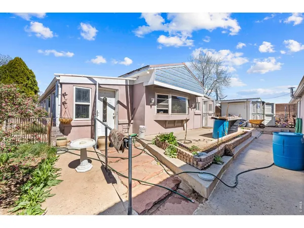 a view of a patio with table and chairs with wooden floor