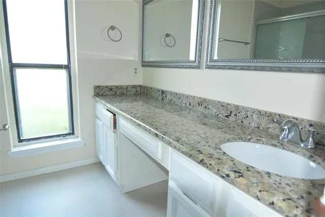 a bathroom with a toilet sink and shower