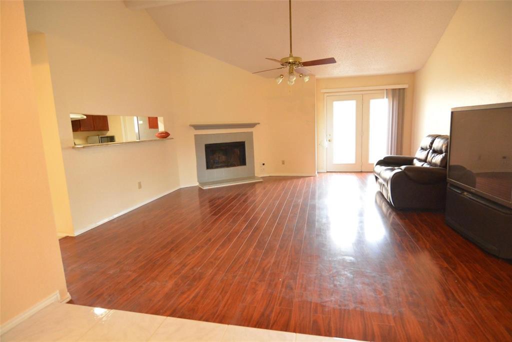 210 Apollo Road Garland, TX 75040 - Photo 7 of 27 a living room with furniture and a fireplace