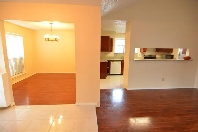 a view of a kitchen cabinets and wooden floor