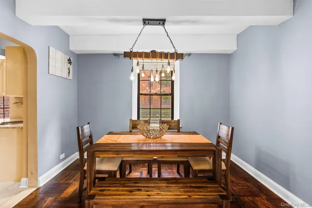 a view of a dining room with furniture window and wooden floor