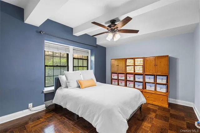 a bedroom with a large bed and a large window