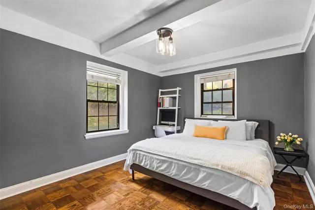 a bedroom with a large bed and a window