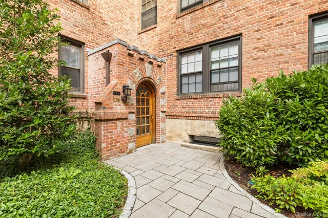 a front view of a house with outdoor space