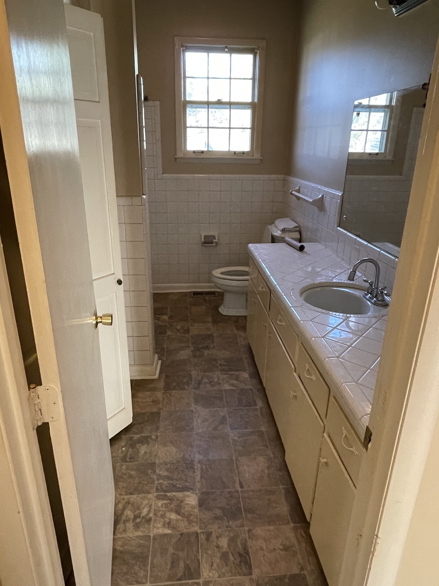 550 East Jefferson Street Pulaski, TN 38478 - Photo 13 of 23 a bathroom with a sink a toilet and a mirror