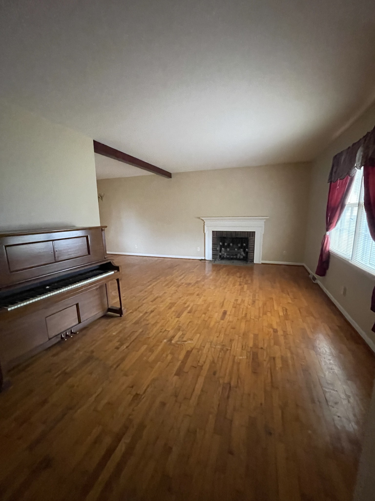 550 East Jefferson Street Pulaski, TN 38478 - Photo 21 of 23 an empty room with wooden floor cabinet and windows