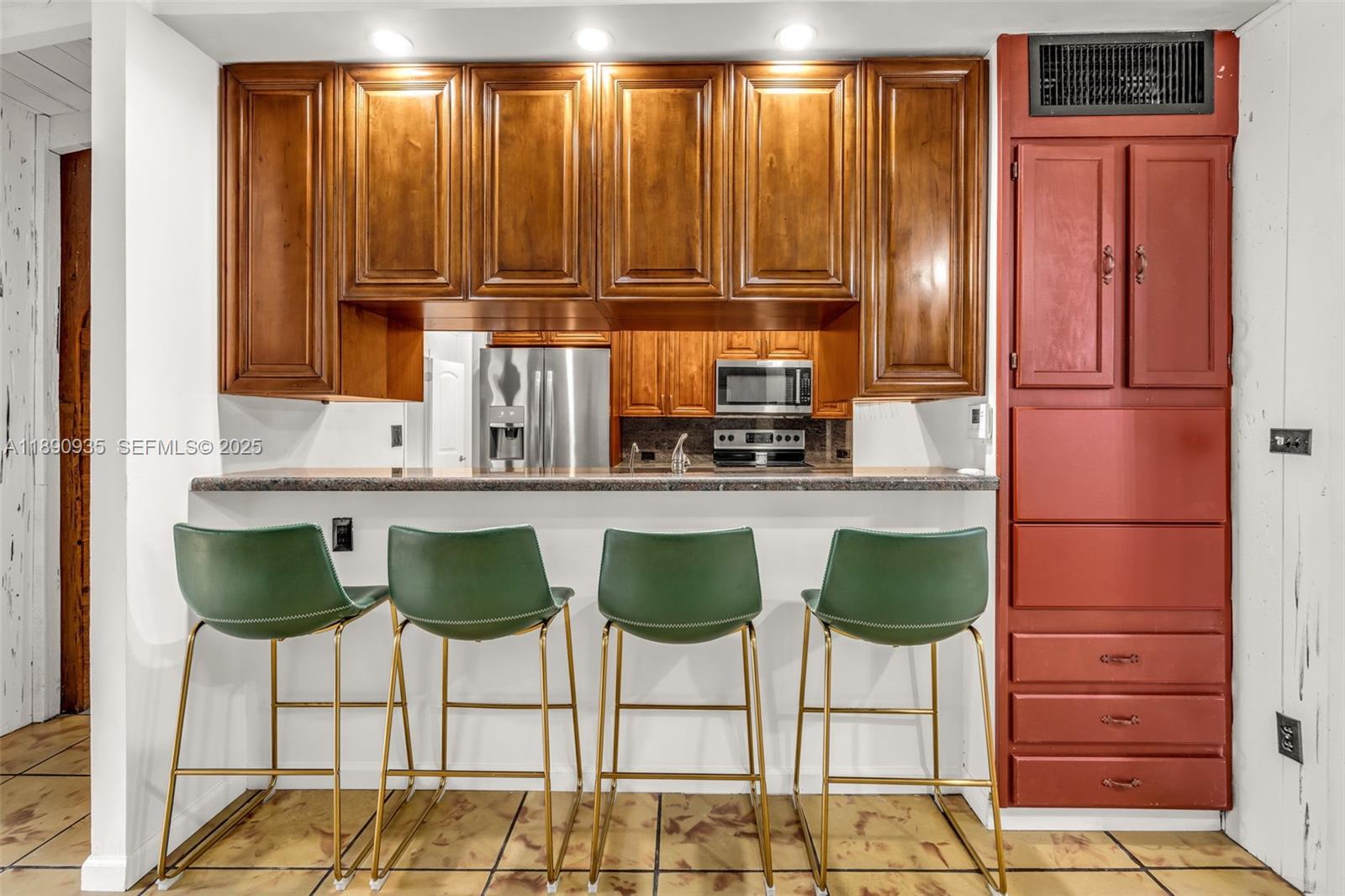 6031 Southwest 82nd Avenue Miami, FL 33143 - Photo 14 of 42 a kitchen with cabinets and chairs