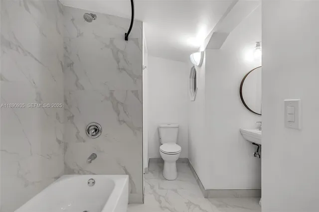 a bathroom with a sink and mirror
