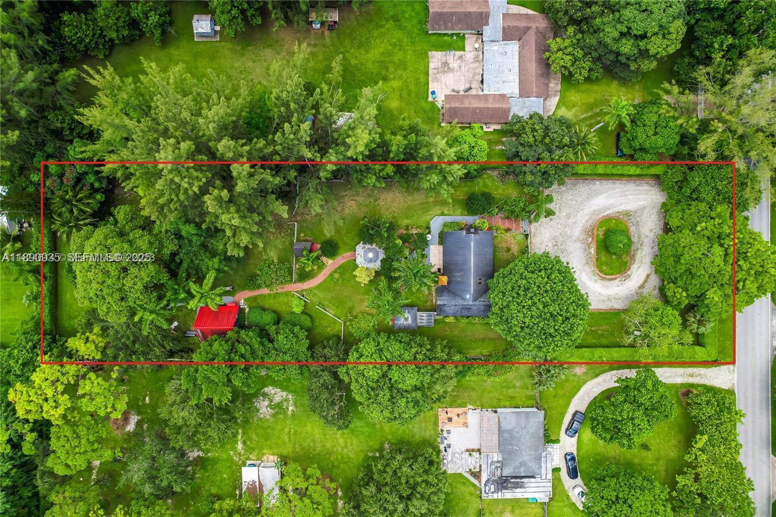 6031 Southwest 82nd Avenue Miami, FL 33143 - Photo 42 of 42 an aerial view of a house with a yard and lake view