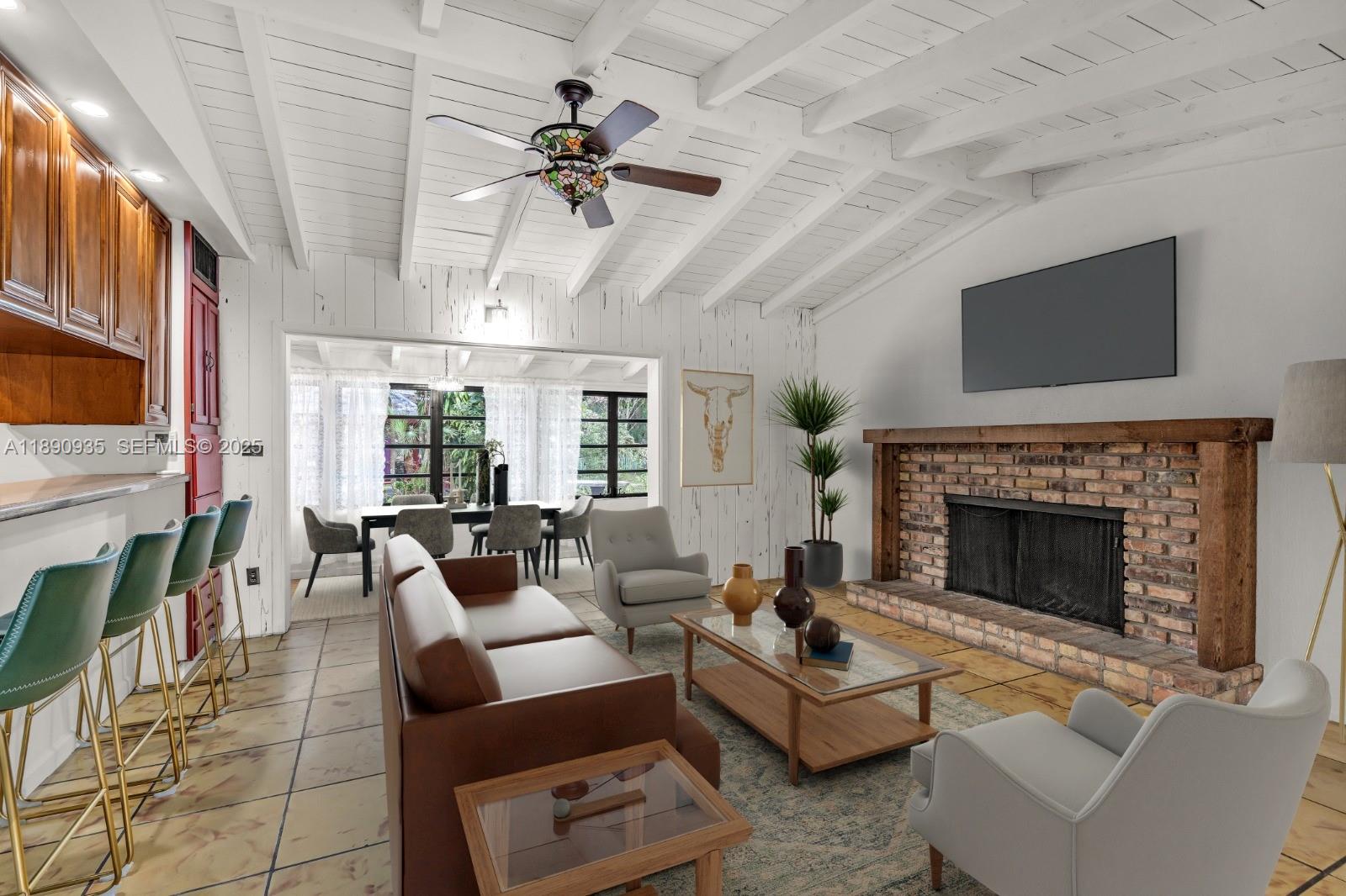 6031 Southwest 82nd Avenue Miami, FL 33143 - Photo 10 of 42 a living room with furniture and a fireplace