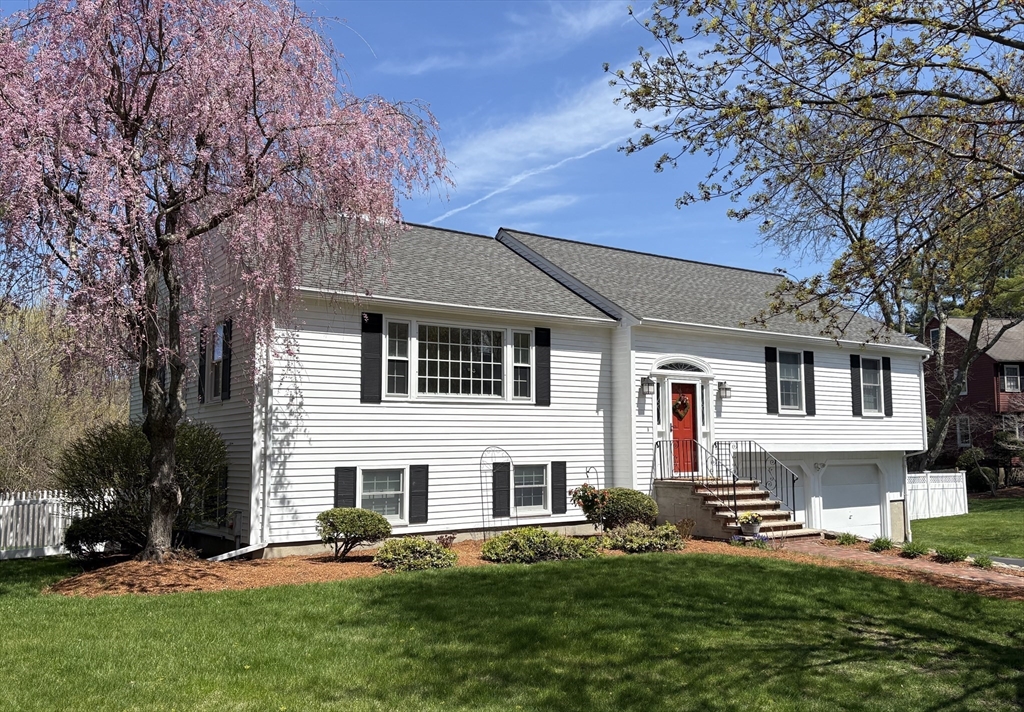 6 Apollo Circle Lexington, MA 02421 - Photo 1 of 38 a front view of a house with a yard and trees