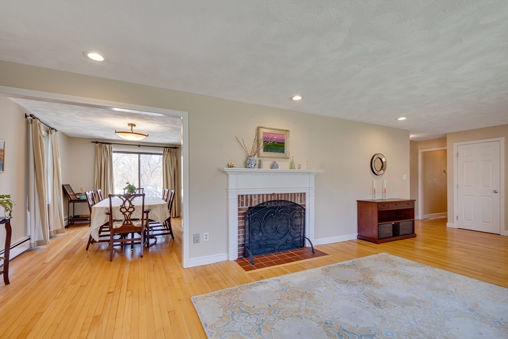 6 Apollo Circle Lexington, MA 02421 - Photo 14 of 38 a living room with furniture and a fireplace
