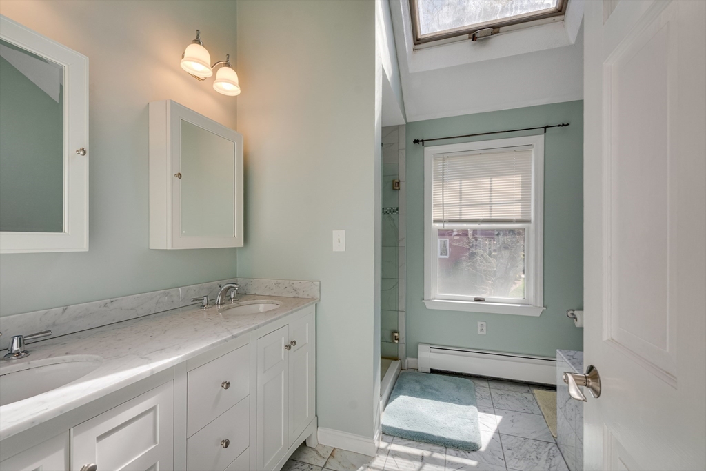 6 Apollo Circle Lexington, MA 02421 - Photo 17 of 38 a bathroom with a sink and a mirror