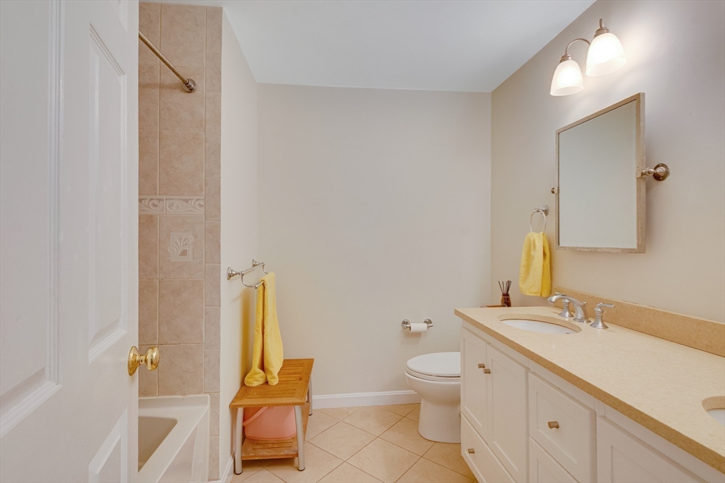 6 Apollo Circle Lexington, MA 02421 - Photo 21 of 38 a bathroom with a toilet sink and mirror
