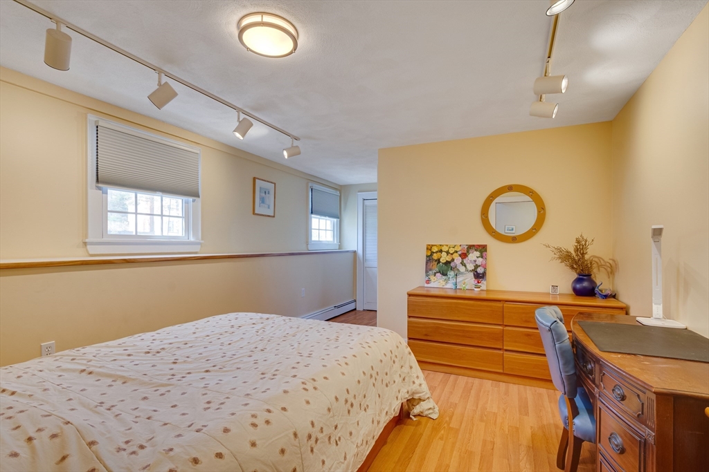 6 Apollo Circle Lexington, MA 02421 - Photo 23 of 38 a bedroom with a bed and a dresser