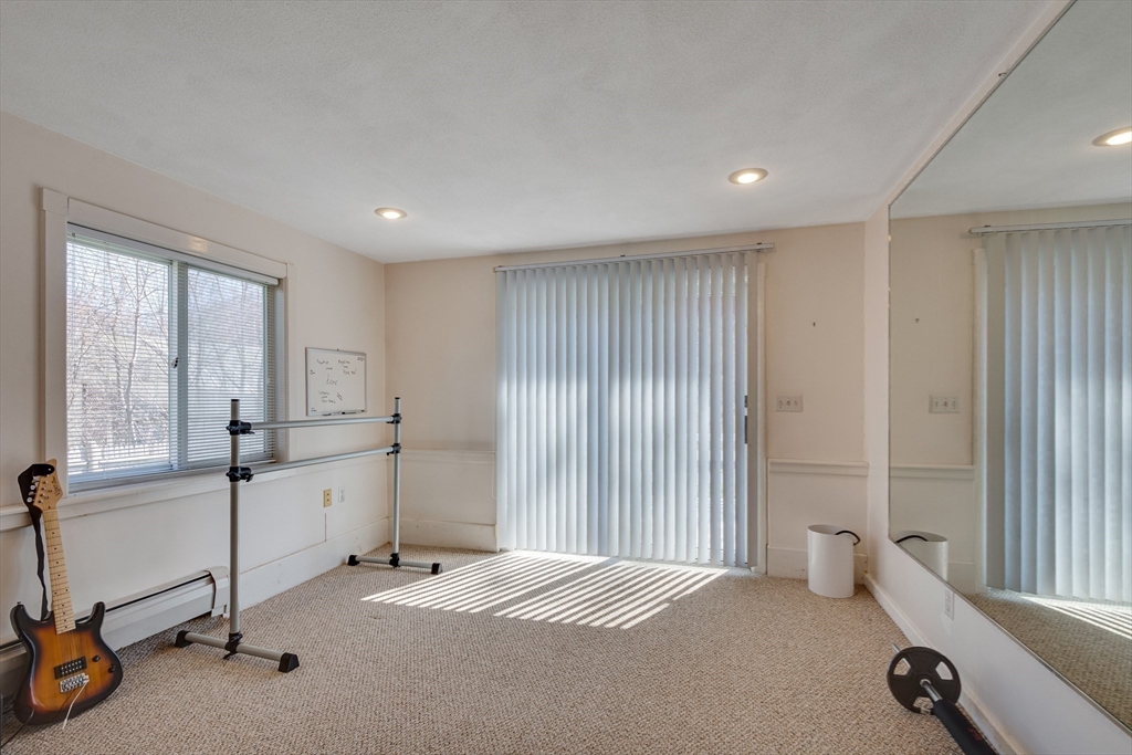 6 Apollo Circle Lexington, MA 02421 - Photo 26 of 38 a room with a bed and a large window