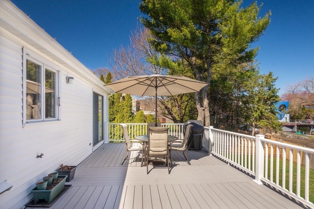 6 Apollo Circle Lexington, MA 02421 - Photo 31 of 38 a view of a chair and table on the deck