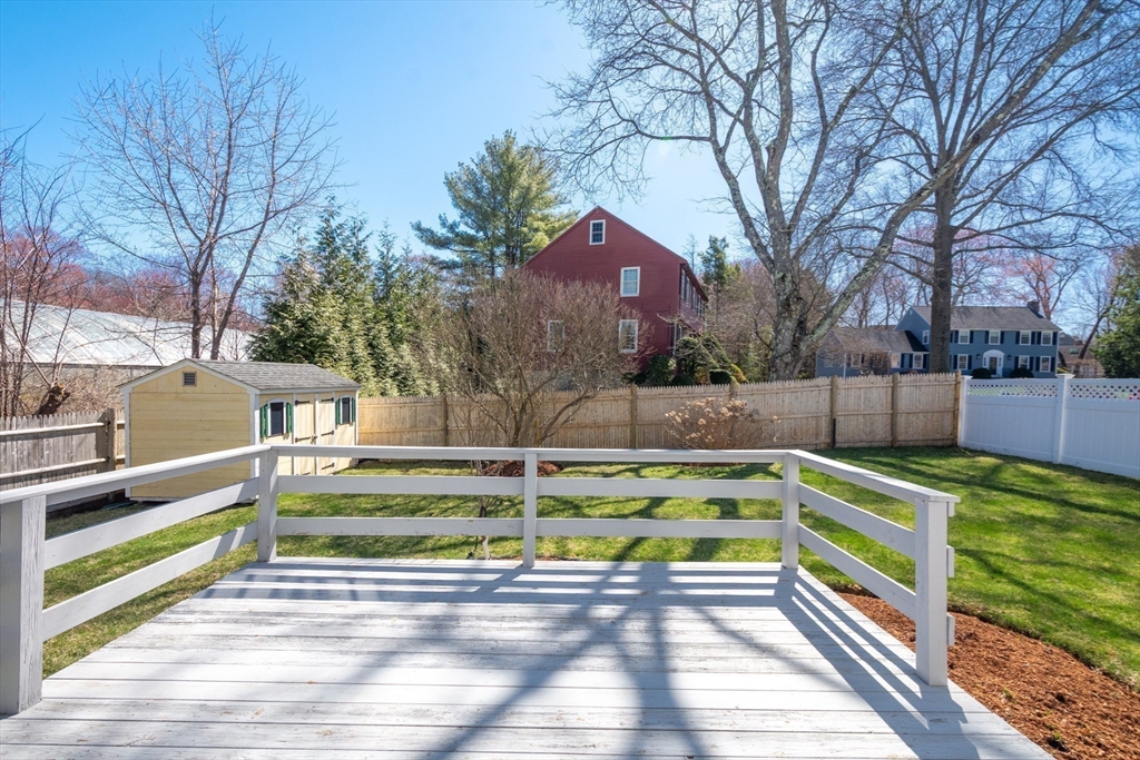 6 Apollo Circle Lexington, MA 02421 - Photo 34 of 38 a view of a backyard with a large tree