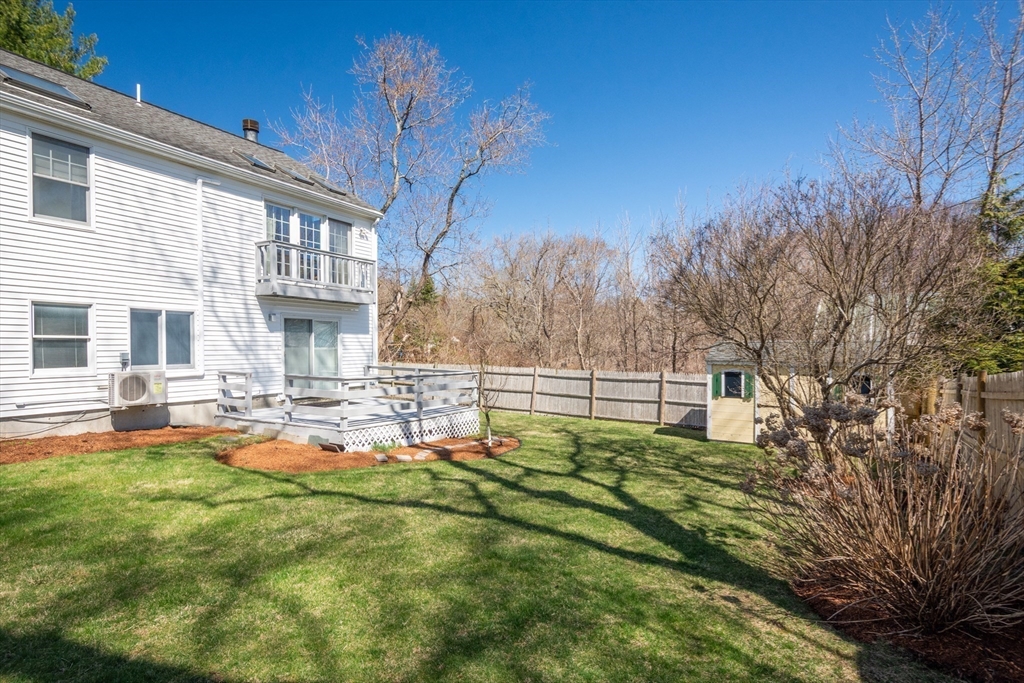 6 Apollo Circle Lexington, MA 02421 - Photo 35 of 38 a front view of a house with swimming pool table and chairs