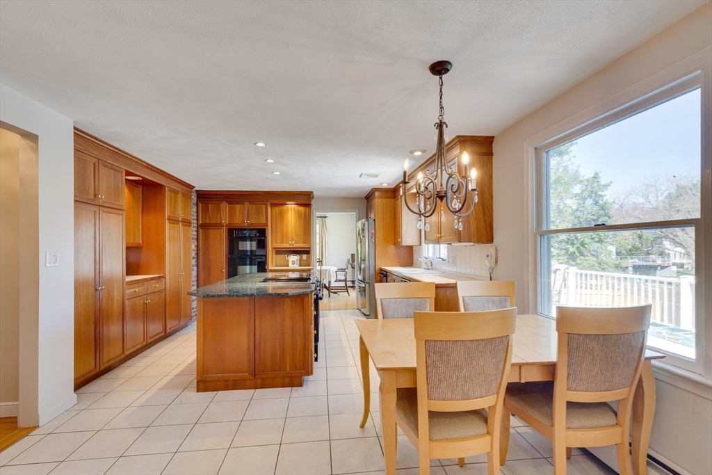6 Apollo Circle Lexington, MA 02421 - Photo 7 of 38 a dining room filled counter top space and a window