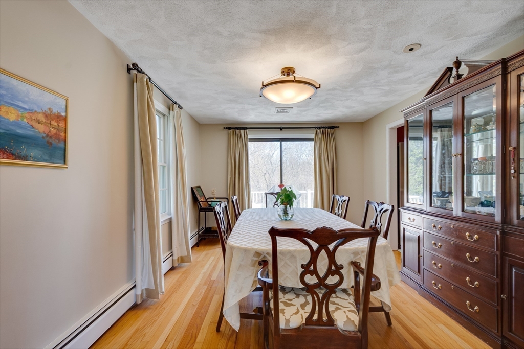 6 Apollo Circle Lexington, MA 02421 - Photo 9 of 38 a view of a dining room with furniture window and wooden floor