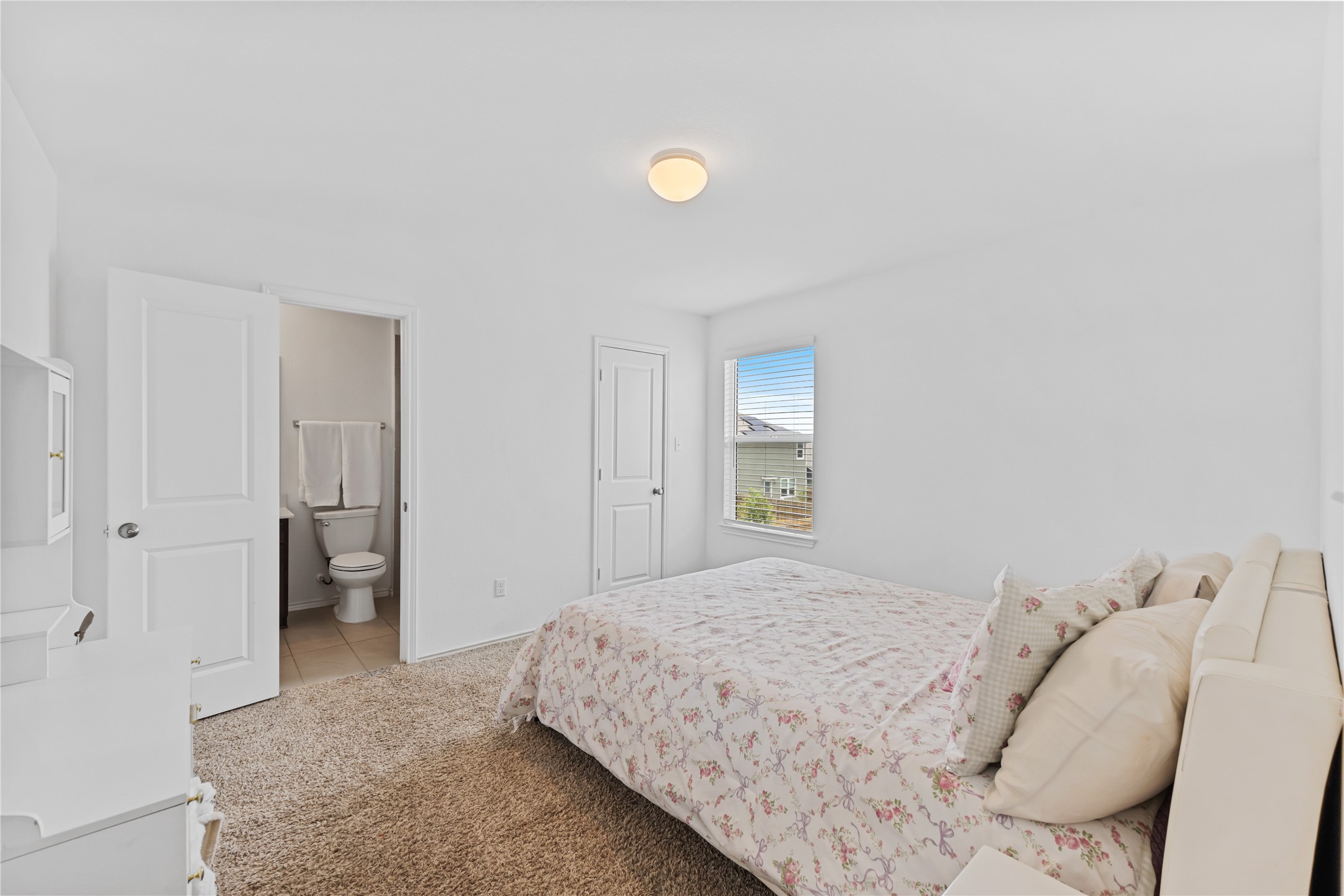 425 Perfect World Loop Jarrell, TX 76537 - Photo 19 of 29 Bedroom with plush carpeting, neutral white walls, and a recessed ceiling light