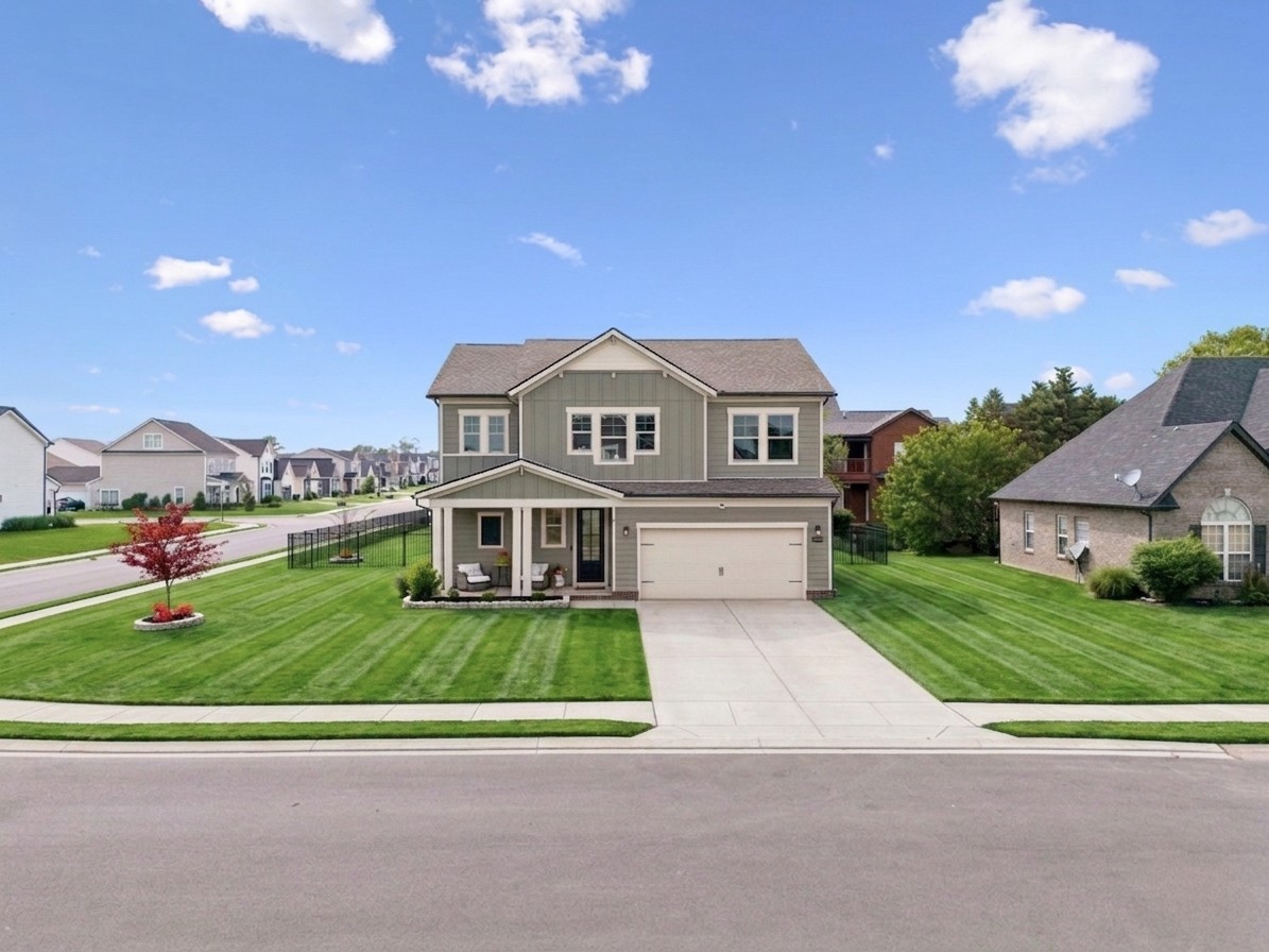 3044 Community Circle Murfreesboro, TN 37128 - Photo 2 of 53 a front view of a house with a garden and yard
