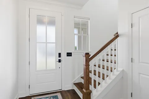 a bedroom with a bed and a table