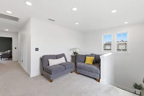 a bedroom with furniture and flat screen tv