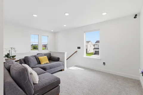 a bedroom with a bed and a flat screen television