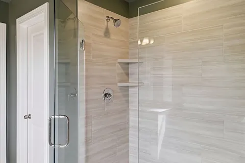 a bedroom with a bed and a night stand