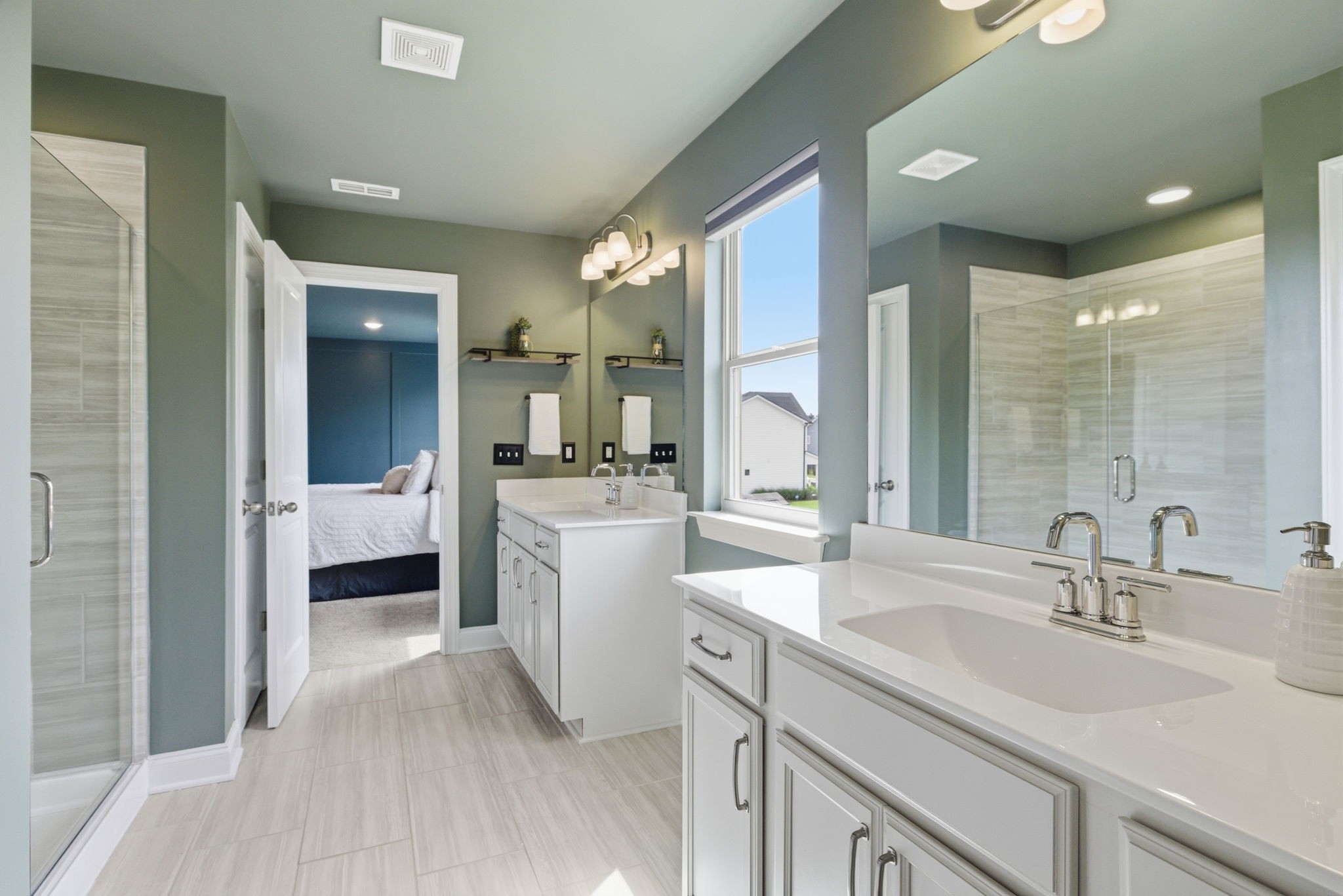 3044 Community Circle Murfreesboro, TN 37128 - Photo 32 of 53 a bathroom with a double vanity sink a mirror and a bathtub
