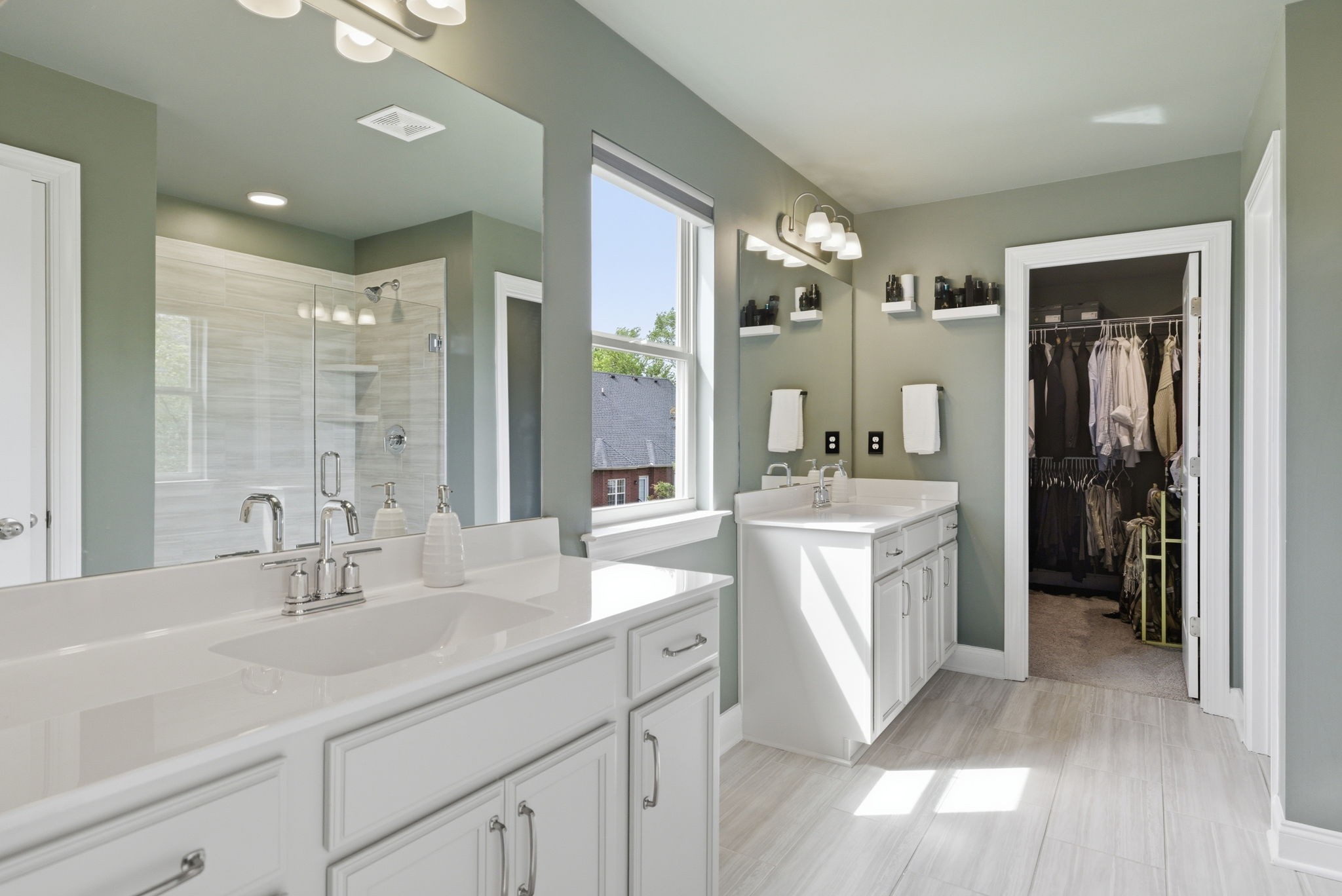 3044 Community Circle Murfreesboro, TN 37128 - Photo 33 of 53 a bathroom with a double vanity sink a mirror and a shower
