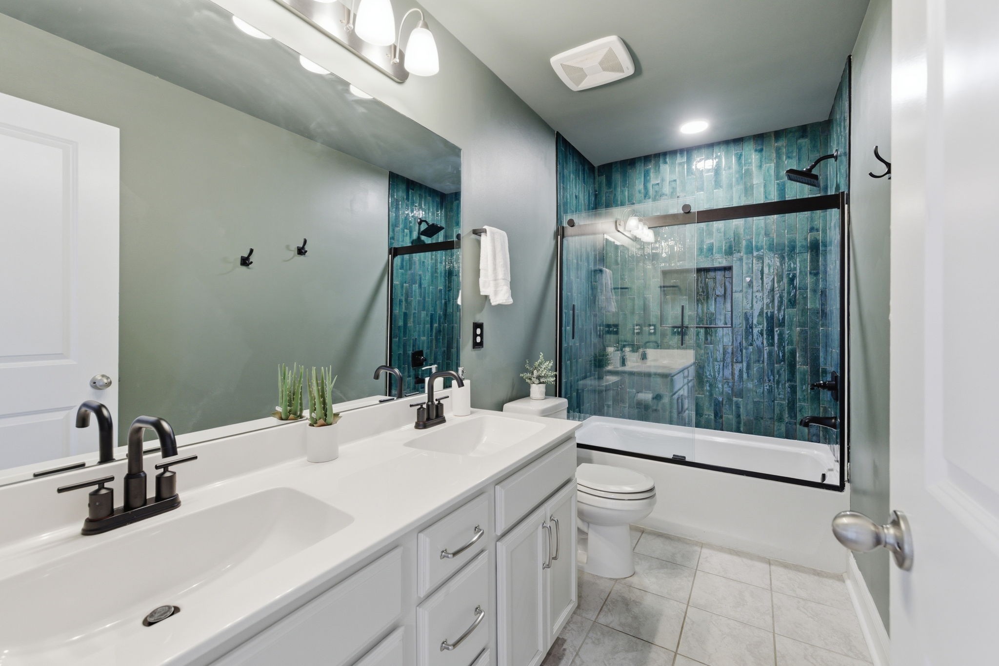3044 Community Circle Murfreesboro, TN 37128 - Photo 37 of 53 a bathroom with a double vanity sink toilet mirror and shower