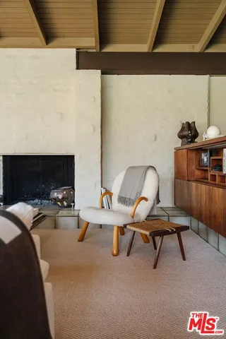 a view of a workspace with furniture