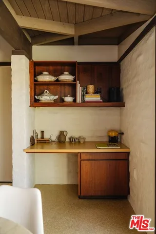 a kitchen with stainless steel appliances granite countertop a sink and wooden cabinets