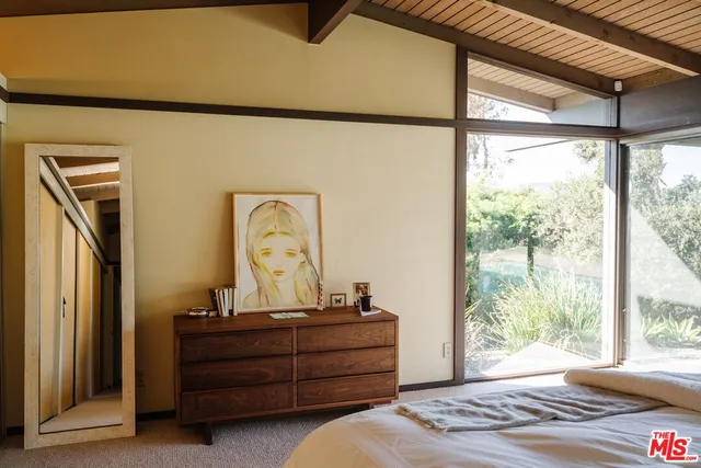 a room with a bed and a window