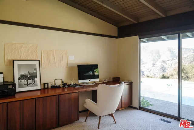 a workspace with furniture and window