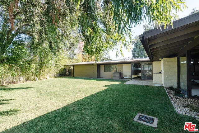 a front view of house with yard patio and green space