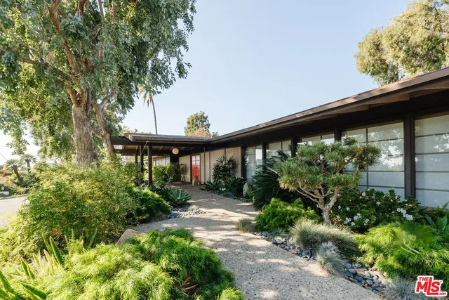 a view of a backyard with garden