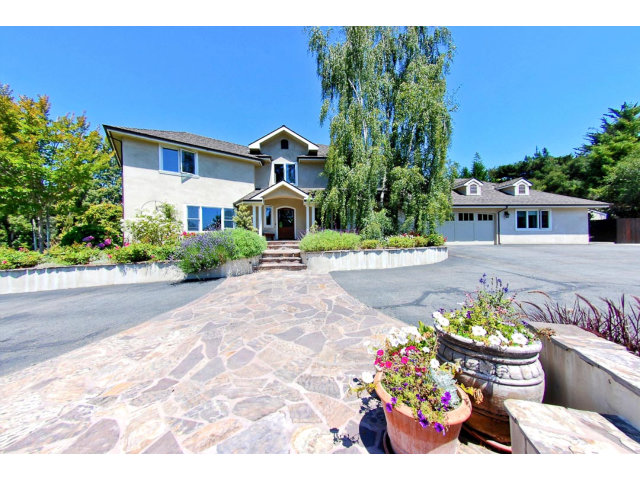 1020 Pleasant Valley Road Aptos, CA 95003 - Photo 1 of 25 a front view of a house with a yard